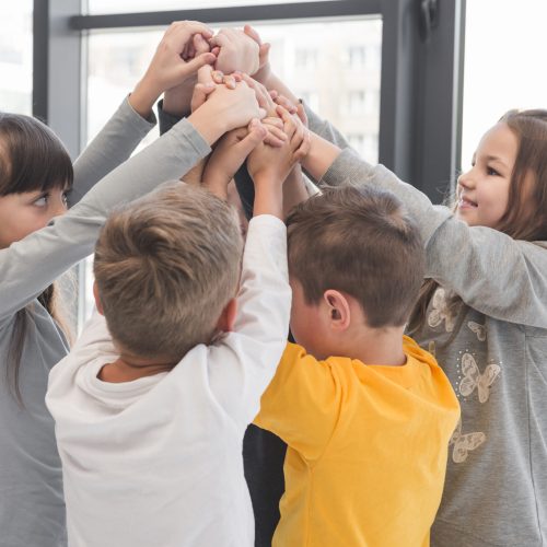 children-with-their-hands-up